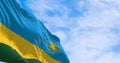 Close-up of Rwanda national flag waving on a clear day