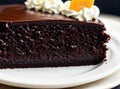 Close-up of Sacher Torte on a serving plate, a dense chocolate cake with a thin layer of apricot jam, coated in dark Royalty Free Stock Photo