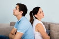 Close Up Of Sad Couple Sitting Back To Back Royalty Free Stock Photo