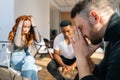 Close-up of sad depressed young man talking about problems on group interpersonal therapy session sitting on chairs in Royalty Free Stock Photo