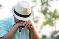 Close up sad elderly asian old man lost in thought sitting in park. Senior healthcare concept Royalty Free Stock Photo