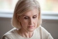 Close up of sad senior woman remembering missing past Royalty Free Stock Photo