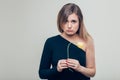 Close up Sad Young Woman Holding a Dead Rose Flower While Looking at the Camera Royalty Free Stock Photo