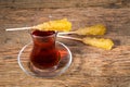 Close Up Of Saffron Rock Candy Sugar Crystal On A Black Tea Cup Royalty Free Stock Photo