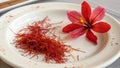 Close-Up of Saffron Spice Threads and Flower on Plate Royalty Free Stock Photo