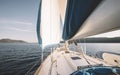 Close up of sailboat bow with raised spinnaker Royalty Free Stock Photo