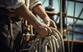 Close-up of sailor hands organizing the ropes of the sailing boat and creating maritime knots Royalty Free Stock Photo