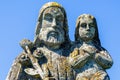 Close up saint Joseph with little Jesus Christ. Very ancient stone statue Royalty Free Stock Photo