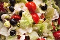 Close-up of salad, tomatoes, onions and black olives washed and cut with the addition of Greek  sheep and goat cheese called `feta Royalty Free Stock Photo