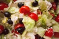 Close-up of salad, tomatoes, onions and black olives washed and cut with the addition of Greek  sheep and goat cheese called `feta Royalty Free Stock Photo