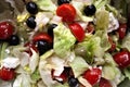 Close-up of salad, tomatoes, onions and black olives washed and cut with the addition of Greek  sheep and goat cheese called `feta Royalty Free Stock Photo