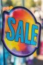 A close up of a sale sign hanging on the side of a building, AI Royalty Free Stock Photo