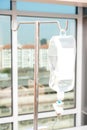 Close up saline IV drip for patient and Infusion pump in hospital Royalty Free Stock Photo