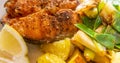Close-up of salmon cutlet with potatoes on spring onions and sugar snap peas Royalty Free Stock Photo
