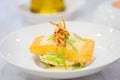 Close-up of salmon fillet with rice cakes, green beans, lemon butter garlic sauce. Seafood dish on white plate. Healthy lunch. Royalty Free Stock Photo