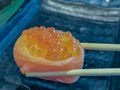 Close up Salmon Ikura Gunkan sushi.A popular Japanese food made of the basic ingredients with rice seaweed accompanied by salmon a