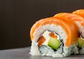 Close up of salmon roll sushi on table