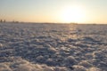 Close-up of salt marsh at Rann of Kutch with setting sun in the background- Rann utsav - white desert - Gujarat tourism - Twilight Royalty Free Stock Photo