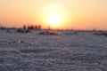 Close-up of salt marsh at Rann of Kutch with setting sun in the background- Rann utsav - white desert - Gujarat tourism - Twilight Royalty Free Stock Photo