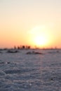 Close-up of salt marsh at Rann of Kutch with setting sun in the background- Rann utsav - white desert - Gujarat tourism - Twilight Royalty Free Stock Photo