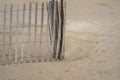 Close up of a sand dunes on a beach with wooden fence Royalty Free Stock Photo