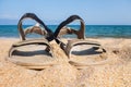 Close-up sandals on the sand at the beach. Sports summer shoes. Hiking, outdoor activities. Royalty Free Stock Photo