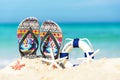 Close up sandals on the sand beach with starfish sandy beach. Royalty Free Stock Photo