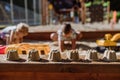 Close up of sands cake made by children in background. Royalty Free Stock Photo