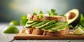 Close up of sandwiches with avocado in kitchen at home, copy space 2