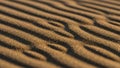 Close up of sandy ripples forming natural patterns on a beach Royalty Free Stock Photo