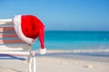 Close up Santa hat on chair longue at tropical Royalty Free Stock Photo