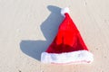 Close up Santa hat on a white sandy beach Royalty Free Stock Photo