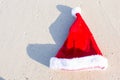 Close up Santa hat on a white sandy beach Royalty Free Stock Photo