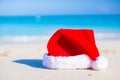 Close up Santa hat on a white sandy beach Royalty Free Stock Photo