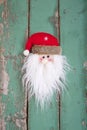 Close up of Santa head on wooden background for christmas