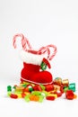 Santa stocking full of candies in a white background