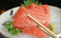 Close-up sashimi salmon on chopstick