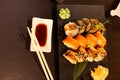 Close up of sashimi sushi set with chopsticks and soy - sushi roll with salmon