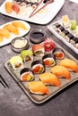 Close up of sashimi sushi set with chopsticks and soy - sushi roll with salmon and sushi roll with smoked eel Royalty Free Stock Photo