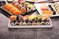 Close up of sashimi sushi set with chopsticks and soy - sushi roll with salmon and sushi roll with smoked eel Royalty Free Stock Photo