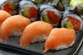 Close up of sashimi sushi set with chopsticks and soy - sushi roll with salmon and sushi roll with smoked eel Royalty Free Stock Photo