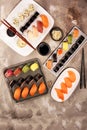 Close up of sashimi sushi set with chopsticks and soy - sushi roll with salmon and sushi roll with smoked eel Royalty Free Stock Photo