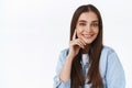 Close-up sassy good-looking stylish brunette woman with long straight hair, smiling pleased with self-assured and cheeky