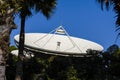 A close-up of a satellite signal receiving antenna station located in the forest