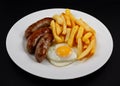 Close up of Sausage, egg and chips. Royalty Free Stock Photo