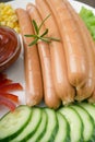 Close up of sausage and fresh vegetables Royalty Free Stock Photo
