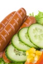 Close up of sausage and fresh vegetables Royalty Free Stock Photo