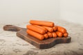 Close-up of sausages. Sausages on the blackboard and place for text. Boiled raw bavarian sausages and copy space Royalty Free Stock Photo