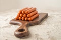 Close-up of sausages. Sausages on the blackboard and place for text. Boiled raw bavarian sausages and copy space Royalty Free Stock Photo