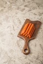 Close-up of sausages. Sausages on the blackboard and place for text. Boiled raw bavarian sausages and copy space Royalty Free Stock Photo